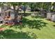 Large grassy backyard featuring a brick patio, wooden deck, and a swing set at 207 Littlejohn St, Summerville, SC 29483