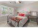 Bedroom with a bed, ceiling fan, side tables, and a window at 207 Littlejohn St, Summerville, SC 29483