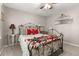 Bedroom with a bed, ceiling fan, side tables, and a mirror at 207 Littlejohn St, Summerville, SC 29483