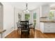 Cozy breakfast nook with bay windows and hardwood floors at 207 Littlejohn St, Summerville, SC 29483