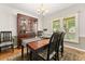 Charming dining room featuring a china cabinet and a view of the outdoor scenery at 207 Littlejohn St, Summerville, SC 29483