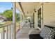 Spacious front porch with rocking chairs, offering a relaxing outdoor space at 207 Littlejohn St, Summerville, SC 29483