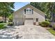 Two-car attached garage with a side entrance and a well-kept driveway at 207 Littlejohn St, Summerville, SC 29483
