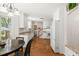 Bright kitchen featuring granite countertops, white cabinets, and hardwood floors at 207 Littlejohn St, Summerville, SC 29483