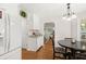 Well-lit kitchen boasting granite counters, white cabinets, and a breakfast nook at 207 Littlejohn St, Summerville, SC 29483