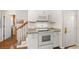 View of white kitchen featuring modern appliances and granite countertops at 207 Littlejohn St, Summerville, SC 29483