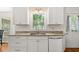 Bright kitchen featuring stainless steel appliances, granite countertops, and ample storage at 207 Littlejohn St, Summerville, SC 29483