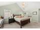 View of main bedroom showcasing the high ceilings and en suite bath access at 207 Littlejohn St, Summerville, SC 29483