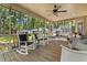 Screened porch with seating area and a ceiling fan at 207 Littlejohn St, Summerville, SC 29483