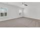 Bright bedroom with white walls, ceiling fan, and plantation shutters at 210 Wildberry Ln, Goose Creek, SC 29445