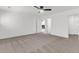 Spacious bedroom with neutral carpet, ceiling fan, and white trim at 210 Wildberry Ln, Goose Creek, SC 29445