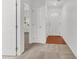 Hallway with white doors, neutral carpeting, and wood floors at the entryway at 210 Wildberry Ln, Goose Creek, SC 29445