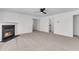Spacious living room with a fireplace, a ceiling fan, and neutral carpet at 210 Wildberry Ln, Goose Creek, SC 29445
