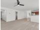 Open-concept living area featuring neutral carpet and a ceiling fan at 210 Wildberry Ln, Goose Creek, SC 29445