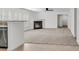 Open floor plan offering a fireplace, neutral carpet, and easy access to the kitchen at 210 Wildberry Ln, Goose Creek, SC 29445