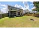 View of a spacious backyard with a fire pit at 2106 Clipstone Dr, Ladson, SC 29456
