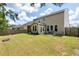 View of a spacious backyard with a fire pit at 2106 Clipstone Dr, Ladson, SC 29456