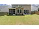 View of a spacious backyard with a fire pit at 2106 Clipstone Dr, Ladson, SC 29456
