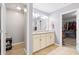 This bathroom features double sinks with granite countertops and a well-organized closet, providing comfort and functionality at 2106 Clipstone Dr, Ladson, SC 29456