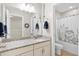 Bathroom featuring a granite countertop, large mirror, and a shower and bath at 2106 Clipstone Dr, Ladson, SC 29456