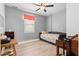 Bedroom with gray walls and wood-look floors featuring a window with natural light and a daybed at 2106 Clipstone Dr, Ladson, SC 29456