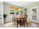 This well lit dining room is enhanced by updated flooring, large windows, and backyard access at 2106 Clipstone Dr, Ladson, SC 29456