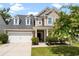 Charming two-story home with a well-manicured lawn and a two car garage at 2106 Clipstone Dr, Ladson, SC 29456