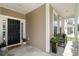 Charming front porch with plants and seating area provides a warm welcome at 2106 Clipstone Dr, Ladson, SC 29456
