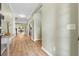 Spacious hallway with wood floors leads to various rooms in the home at 2106 Clipstone Dr, Ladson, SC 29456
