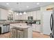 Well-lit kitchen featuring stainless steel appliances, granite counters, and a functional island at 2106 Clipstone Dr, Ladson, SC 29456