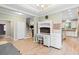 Bright living area showcasing wood floors, study area and seamless flow to the kitchen at 2106 Clipstone Dr, Ladson, SC 29456