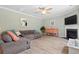 Comfortable living room showing the fireplace, wood floors, and neutral paint at 2106 Clipstone Dr, Ladson, SC 29456