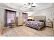 This main bedroom is a calm and comfortable retreat with decorative trim, updated flooring, and modern conveniences at 2106 Clipstone Dr, Ladson, SC 29456