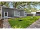 Expansive backyard featuring lush green grass and mature trees, perfect for outdoor activities and relaxation at 216 Freeman St, Mount Pleasant, SC 29464