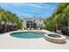 Backyard with a large pool, spa, and outdoor seating, perfect for entertaining or relaxing in the sun at 216 Freeman St, Mount Pleasant, SC 29464