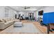 Versatile basement with a home gym, comfortable seating area, and a light gray rug at 216 Freeman St, Mount Pleasant, SC 29464