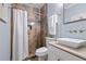 Bathroom with a neutral-tiled walk-in shower, vessel sink, and modern fixtures at 216 Freeman St, Mount Pleasant, SC 29464