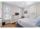 Cozy bedroom with natural light, light-colored walls, a decorative dresser, and hardwood floors at 216 Freeman St, Mount Pleasant, SC 29464
