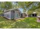 Charming gray home with a covered porch, offering an inviting outdoor living space for relaxation at 216 Freeman St, Mount Pleasant, SC 29464