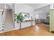 Open foyer with hardwood floors, staircase, and decoratively appointed console table at 216 Freeman St, Mount Pleasant, SC 29464