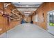 Spacious garage featuring ample storage, shelving, work area, and epoxy floor, providing a functional workspace at 216 Freeman St, Mount Pleasant, SC 29464