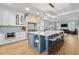 Bright kitchen with a large island, custom cabinets, and views to the living room at 216 Freeman St, Mount Pleasant, SC 29464