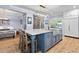 A beautiful kitchen with a large center island that offers seating, generous counter space, and a farmhouse sink at 216 Freeman St, Mount Pleasant, SC 29464