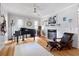 Inviting living room with a fireplace, piano, guitar, and comfortable leather armchair at 216 Freeman St, Mount Pleasant, SC 29464
