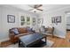 Comfortable living room featuring a cozy couch, window with shutters, and a writing desk at 216 Freeman St, Mount Pleasant, SC 29464