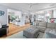 Spacious living room with an open floor plan, hardwood floors, and a neutral color palette at 216 Freeman St, Mount Pleasant, SC 29464