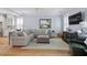 Comfortable living room with a plush sectional sofa, light blue walls, and hardwood flooring at 216 Freeman St, Mount Pleasant, SC 29464