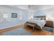 Relaxing main bedroom with a large bed, stylish nightstands, area rugs, and windows for natural light at 216 Freeman St, Mount Pleasant, SC 29464