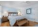 Comfortable main bedroom featuring a large bed, a bench, nightstands, and hardwood floors at 216 Freeman St, Mount Pleasant, SC 29464