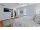 Comfortable main bedroom boasting hardwood floors, television, walk-in closet, and natural light at 216 Freeman St, Mount Pleasant, SC 29464